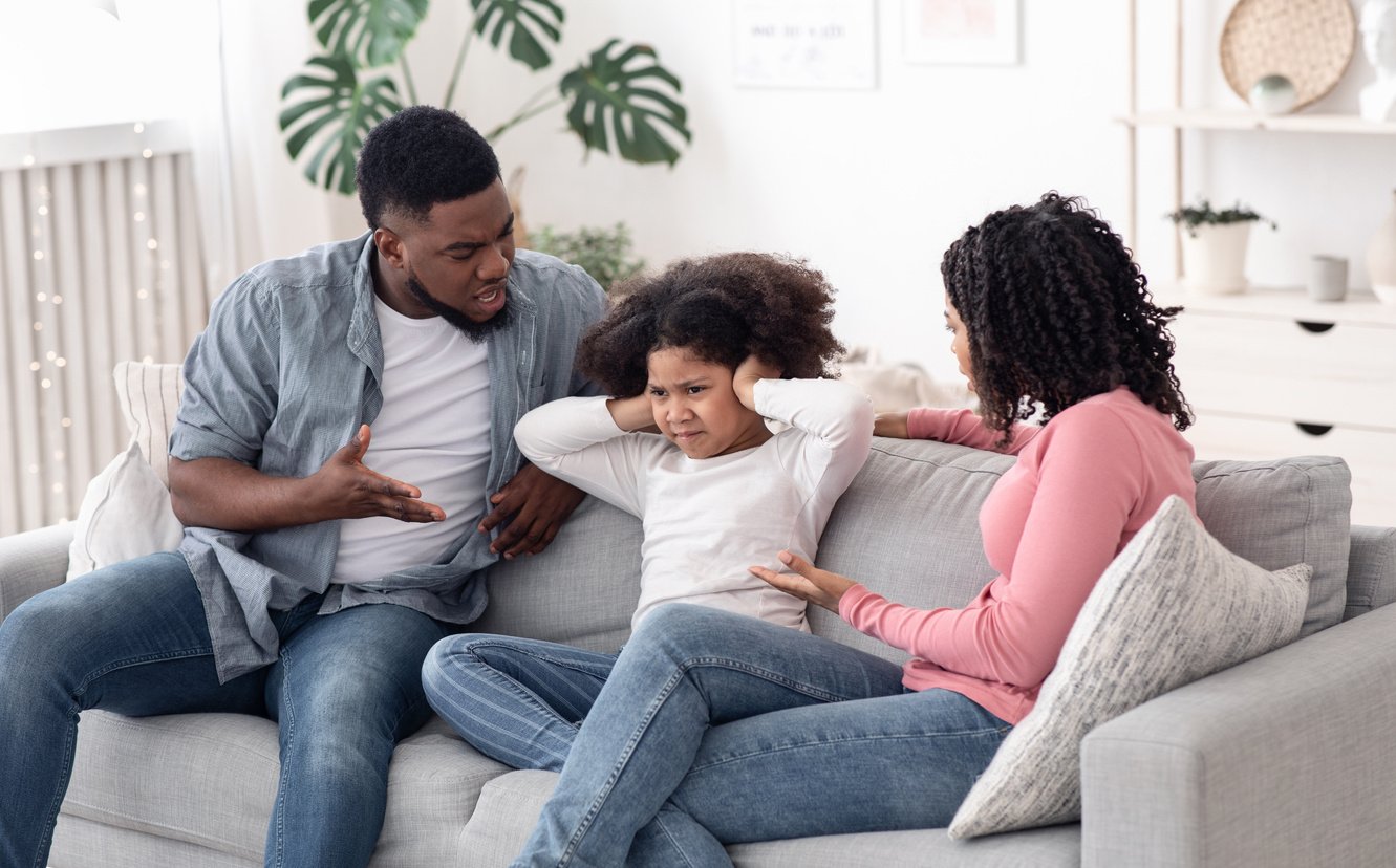 Annoyed Black Parents Scolding Stubborn Little Daughter At Home